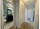Hallway bathroom with dark vanity and tiled shower at 61 Lakewood Dr., Andrews, SC 29510