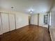 Spacious bedroom with hardwood floors, closet, and ensuite bathroom access at 61 Lakewood Dr., Andrews, SC 29510