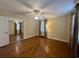 Comfortable bedroom with hardwood floors, ceiling fan, and lots of natural light at 61 Lakewood Dr., Andrews, SC 29510