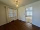 Hardwood floors, neutral paint, and natural light creates a warm bedroom space at 61 Lakewood Dr., Andrews, SC 29510