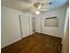 Bedroom featuring hardwood floors, ceiling fan, closet, and lots of natural light at 61 Lakewood Dr., Andrews, SC 29510
