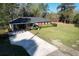 Charming brick home with large front yard, mature trees, and extended drive at 61 Lakewood Dr., Andrews, SC 29510