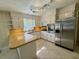 This updated kitchen features stainless appliances, white cabinets and bright countertops at 61 Lakewood Dr., Andrews, SC 29510