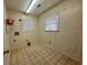 A functional laundry room with vinyl floors, bright lighting, and essential hookups ready for appliances at 61 Lakewood Dr., Andrews, SC 29510