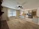 Inviting living room and kitchen area features warm neutral tones and stainless steel appliances at 61 Lakewood Dr., Andrews, SC 29510