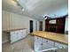Open living room features tile floors, a brick fireplace, neutral tones and easy access to hall at 61 Lakewood Dr., Andrews, SC 29510