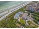 Aerial view of a beachfront resort with multiple pools, a beach, and ocean views at 6121 Bolsena Place, Myrtle Beach, SC 29572