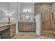 The bathroom features a granite vanity, shower with decorative tiles, and decorative gold lighting at 6121 Bolsena Place, Myrtle Beach, SC 29572