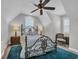 Beautiful bedroom with a wrought iron bed frame, carpet, and bright, sun-filled windows at 6121 Bolsena Place, Myrtle Beach, SC 29572