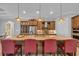 Open kitchen featuring a large island, granite countertops, stainless steel appliances, and seating for four at 6121 Bolsena Place, Myrtle Beach, SC 29572