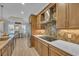 Modern kitchen with custom cabinets, stainless steel appliances, and a stylish backsplash, with a view to the dining area at 6121 Bolsena Place, Myrtle Beach, SC 29572