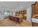 Well-appointed kitchen featuring a central island, custom cabinetry, stainless steel appliances, and modern lighting at 6121 Bolsena Place, Myrtle Beach, SC 29572
