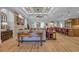 Spacious living room featuring hardwood floors, fireplace and open layout at 6121 Bolsena Place, Myrtle Beach, SC 29572