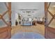 Bright open-concept living space with hardwood floors and coffered ceilings at 6121 Bolsena Place, Myrtle Beach, SC 29572
