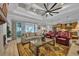 Open living room with hardwood floors, coffered ceilings, and access to the kitchen at 6121 Bolsena Place, Myrtle Beach, SC 29572