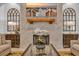 Inviting living room showcasing a cozy fireplace, elegant decor, and a beach scene displayed on the television at 6121 Bolsena Place, Myrtle Beach, SC 29572