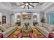 Spacious living room featuring tile fireplace, hardwood floors and neutral palette at 6121 Bolsena Place, Myrtle Beach, SC 29572