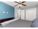 Well-lit bedroom with a closet, ensuite bathroom and stylish gray walls with a blue accent wall at 621 Swinford Dr., Myrtle Beach, SC 29588