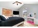 Bedroom with large window, vanity, ceiling fan, and view of the backyard at 621 Swinford Dr., Myrtle Beach, SC 29588