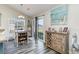 Cozy dining area with decor, natural light, wood flooring, and access to the backyard through sliding doors at 621 Swinford Dr., Myrtle Beach, SC 29588