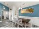 Bright dining area featuring a wooden table, comfortable seating, and stylish decor at 621 Swinford Dr., Myrtle Beach, SC 29588