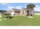 Landscaped front yard with palm tree and decorative stone features and view of the house at 621 Swinford Dr., Myrtle Beach, SC 29588
