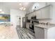 Modern kitchen with granite countertops, stainless steel appliances, cabinetry, and wood flooring at 621 Swinford Dr., Myrtle Beach, SC 29588