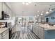 Open kitchen featuring granite countertops, modern appliances, wood flooring and a dining space with natural light at 621 Swinford Dr., Myrtle Beach, SC 29588