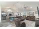 Open concept living space with high ceilings, modern lighting, and bar seating at kitchen island at 621 Swinford Dr., Myrtle Beach, SC 29588