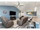 Open-concept living space with modern furnishings connecting to the dining area and kitchen at 621 Swinford Dr., Myrtle Beach, SC 29588