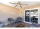 Relaxing covered patio with outdoor seating, ceiling fan and adjacent to the backyard at 621 Swinford Dr., Myrtle Beach, SC 29588