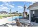 Backyard oasis featuring a pool, comfortable lounge chairs and patio furniture for relaxation at 621 Swinford Dr., Myrtle Beach, SC 29588