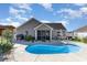 Backyard pool with a patio area and grill, perfect for outdoor entertaining at 621 Swinford Dr., Myrtle Beach, SC 29588