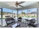 Inviting screened porch with comfortable seating offering views of the pool and backyard at 621 Swinford Dr., Myrtle Beach, SC 29588