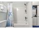Bathroom featuring a toilet, tub, and shower combination, as well as a laundry area at 6253 Catalina Dr. # 713, North Myrtle Beach, SC 29582