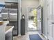 Inviting entryway with stainless steel refrigerator, wood floors, and a view to the outdoors at 6253 Catalina Dr. # 713, North Myrtle Beach, SC 29582