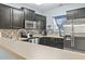 Kitchen with stainless steel appliances, dark cabinetry, and a decorative backsplash at 6253 Catalina Dr. # 713, North Myrtle Beach, SC 29582