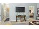 Cozy living room with a TV and views into the bedroom and bathroom at 6253 Catalina Dr. # 713, North Myrtle Beach, SC 29582