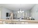 Open concept living area with modern lighting, neutral paint, open to dining room at 6253 Catalina Dr. # 713, North Myrtle Beach, SC 29582