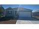 Charming single-story home featuring a two-car garage and well-maintained front yard at 636 Grateful Dr., Little River, SC 29566