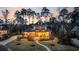 A beautiful home with professional landscaping including manicured lawn with mature trees and a putting green at 644 Whispering Pines Ct., Murrells Inlet, SC 29576