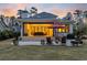 Backyard patio with a gas grill, fire pit, and an outdoor seating area, great for entertaining at 644 Whispering Pines Ct., Murrells Inlet, SC 29576