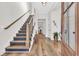 Inviting foyer with hardwood floors, a staircase, and lots of natural light at 644 Whispering Pines Ct., Murrells Inlet, SC 29576