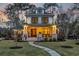 Charming two-story home with inviting front porch, manicured lawn, and beautiful landscaping at 644 Whispering Pines Ct., Murrells Inlet, SC 29576