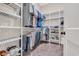 Functional walk-in closet with installed shelving and racks for optimal clothing storage, keeping everything organized at 644 Whispering Pines Ct., Murrells Inlet, SC 29576