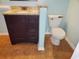 Bathroom with dark vanity, granite counters, tiled flooring, and standard toilet at 6654 Wisteria Dr., Myrtle Beach, SC 29588