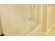 All-white bathroom featuring a shower/tub combo with a tiled surround at 6654 Wisteria Dr., Myrtle Beach, SC 29588