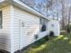A view of the side of this cozy home, showcasing the siding, meter, and manicured lawn at 6654 Wisteria Dr., Myrtle Beach, SC 29588