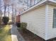 A view of the side of the home showing a path leading to the back at 6654 Wisteria Dr., Myrtle Beach, SC 29588