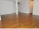 Spacious room with hardwood floors, neutral walls, and abundant natural light at 6654 Wisteria Dr., Myrtle Beach, SC 29588